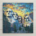Stained glass style Mount Rushmore ceramic tile with the four presidents carved in warm amber and gold light against a dramatic cobalt and teal twilight sky, Black Hills forest below, a vivid patriotic American landmark and national park gift.