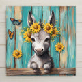 This sweet baby donkey tile features a sunflower crown and rustic teal fence backdrop. Optional cork backing, tile wall hanger, and tile stand available.