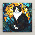 Stained glass style tuxedo cat ceramic tile portrait with bold black and white fur and warm gold light accents against a deep cobalt and teal background, bright curious eyes forward, a vivid cat lover and pet memorial gift.