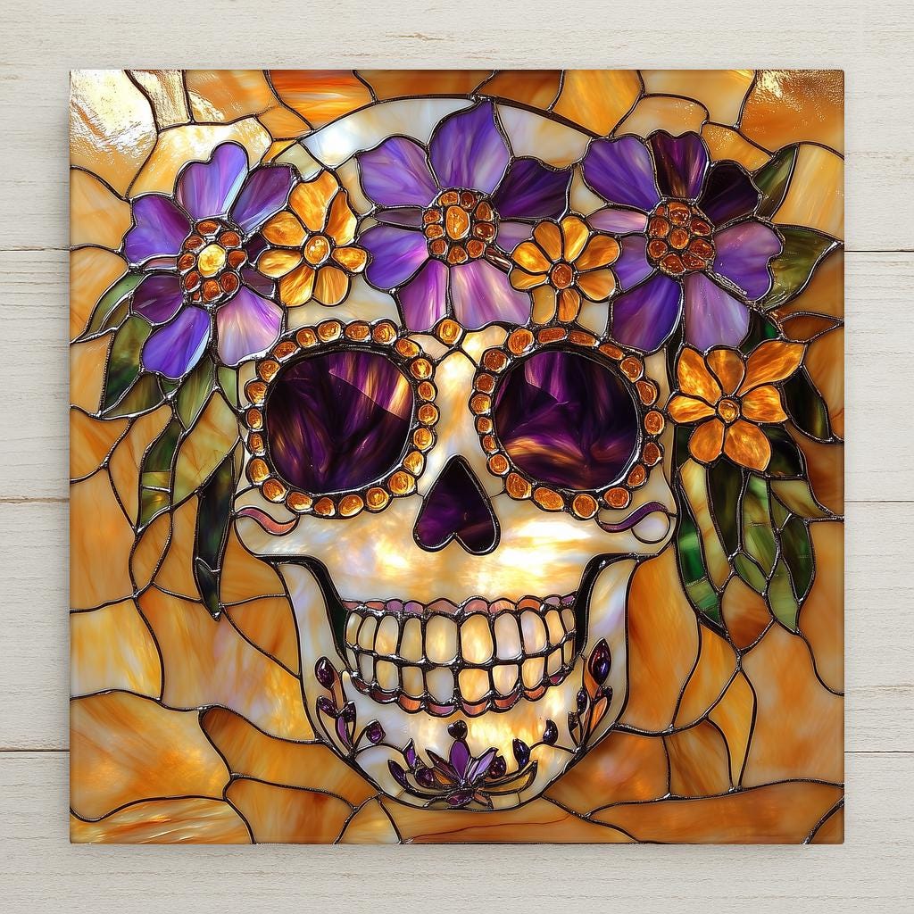 Stained glass style ceramic art tile of a Day of the Dead sugar skull with purple flowers and purple eye-sockets on a warm amber and gold leaded-glass background — a Dia de los Muertos decoration.