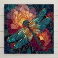 Stained glass style ceramic tile of a teal dragonfly with translucent wings centered on a large blush and peach peony bloom with a glowing golden stamen, surrounded by deep burgundy-rose peony blooms and emerald leaded glass leaves on a dark navy background.