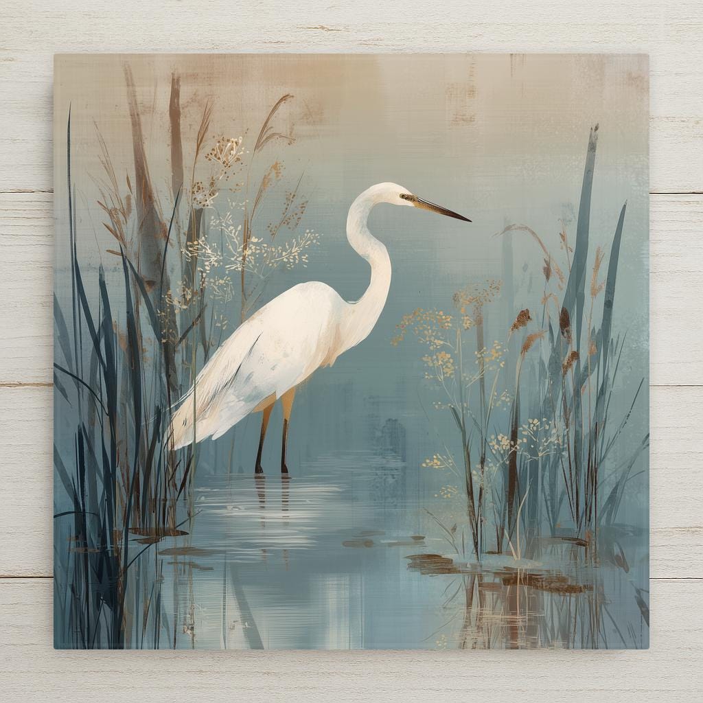 Coastal egret ceramic art tile wading in a marsh with reeds in soft blue grey, sage and cream.