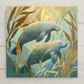 Coastal manatee pair ceramic art tile drifting in calm shallows in warm grey, seafoam and soft blue.