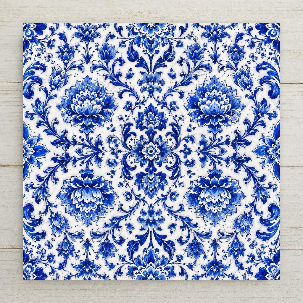 An intricate all-over blue-and-white floral azulejo pattern of symmetrical blossoms and interlacing stems in rich cobalt on a cream-white tile.