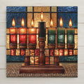 Stained glass style ceramic tile of a kinara with seven lit candles in red black and green glowing against indigo and gold glass