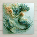 Sea glass style ceramic tile of an elegant mermaid with a tail of smooth turquoise, teal, and seafoam glass pieces gliding through pale aqua water