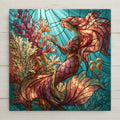 Stained glass style ceramic tile of a mermaid with a coral pink tail among branching coral and two golden seahorses in bright turquoise water