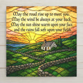Stained glass style ceramic tile of an Irish landscape with rolling emerald green hills and a stone cottage under a sunrise sky, the traditional Irish blessing lettered in calligraphy across the upper sky band