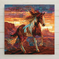 Stained glass style ceramic tile of a brown and white paint horse standing on a mesa rim at sunset with red rock buttes behind