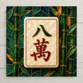 Stained glass style ceramic tile artwork of a mahjong Eight Crak tile with a green figure eight character above a red wan character in gold outline on a cream mother of pearl face, framed by an emerald bamboo grove.