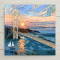 Stained glass style ceramic art tile of the mackinac bridge spanning blue great lakes water at sunset, cream towers and golden cables, a sailboat below and pastel mosaic sky