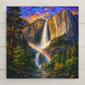 Stained glass style ceramic art tile of Yosemite Falls in full spring flow with a rainbow arcing through the mist at the base, surrounded by green forest under a purple and gold sky