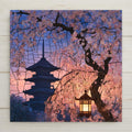 Stained glass style ceramic art tile of a Kyoto pagoda at dusk framed by weeping cherry blossoms in pink and cream, with a glowing wooden lantern hanging from the sakura tree against a violet twilight sky.
