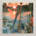 Alcohol ink style ceramic art tile of a dragonfly on a cattail stem at sunset, translucent wings glowing rose and gold, sun reflected on a teal pond veined with gold below.