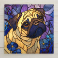Stained glass style portrait of a fawn Pug with a dark mask and folded ears, head tilted, brass-toned came over cream and lavender glass, blue forget-me-not flowers at the lower corners, printed on a glossy ceramic art tile.