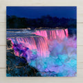 Niagara Falls ceramic art tile in an alcohol ink style — the falls at night under pink, violet, and turquoise floodlights, glowing mist rising against a dark sky.